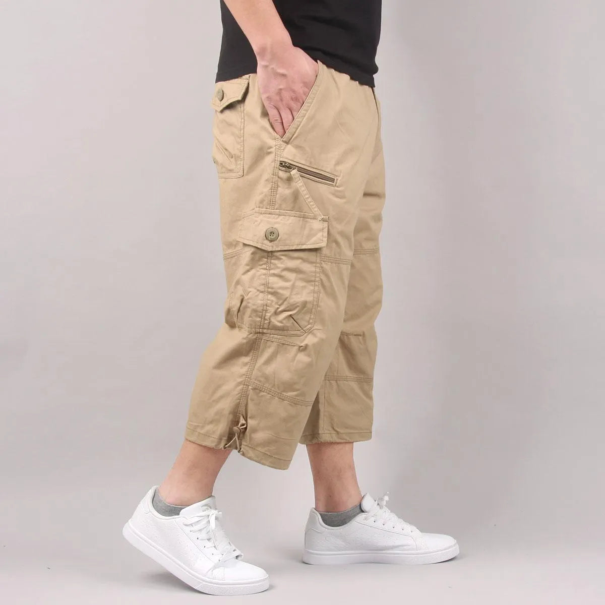 Men's loose fit cotton cropped casual pants in khaki colour on a neutral background.