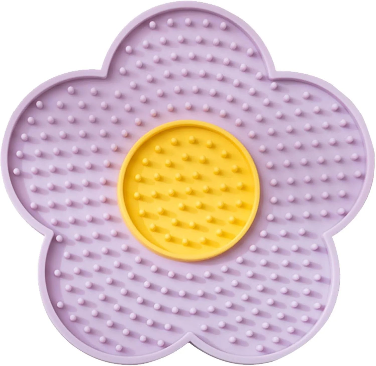 Flower-shaped blue silicone pet licking mat with suction cups on a smooth surface.