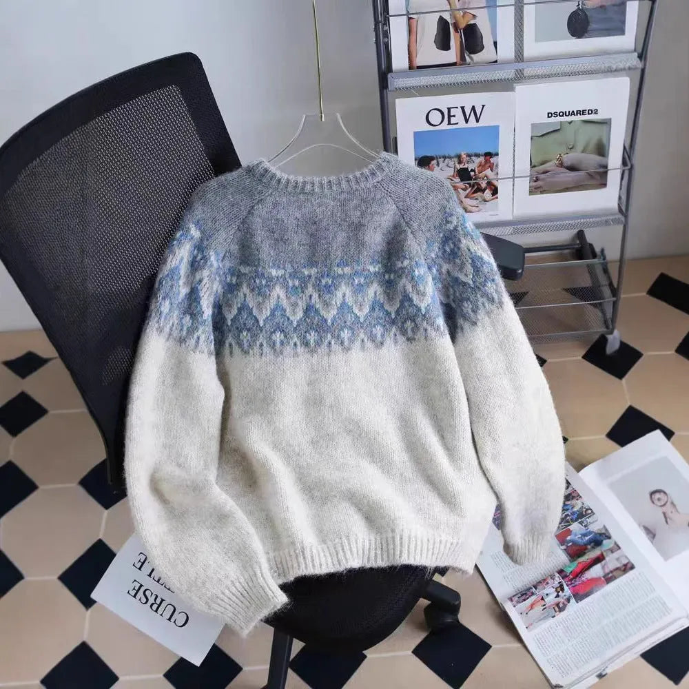 Women's loose fit jacquard knit sweater coat in milky white, shown on a hanger.