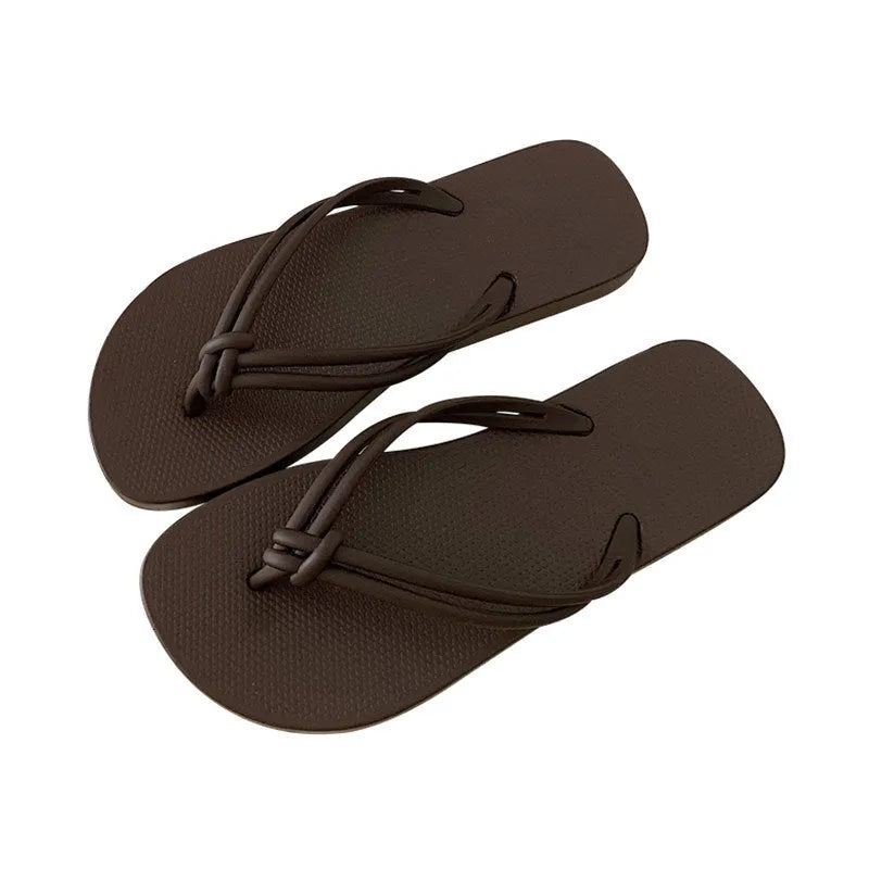 PVC casual flip flops for men with a toe-covering design and textured non-slip soles.
