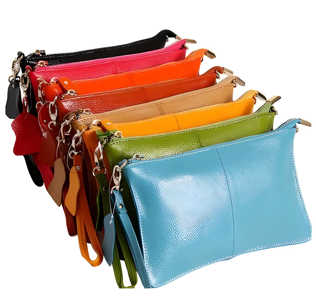 Lady's brown cowhide slant handbag with a long shoulder strap, showing front zip closure.