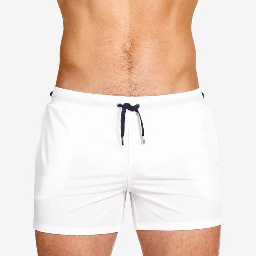 Solid colour swimming shorts with mesh lining for sports and fitness activities
