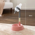 Green height-adjustable standing water dispenser for cats and dogs on a wooden floor.