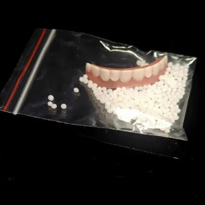 Silicone simulation smile dentures with upper and lower teeth in colour box packaging for dental training