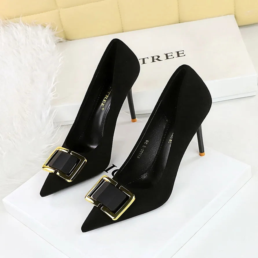 Black suede women's high heel shoes with a tall stiletto heel and tapered toe.