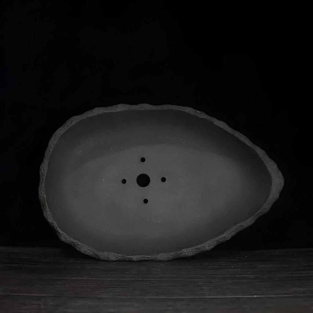 Handmade purple clay flower pot with unique shape for floor-standing plants