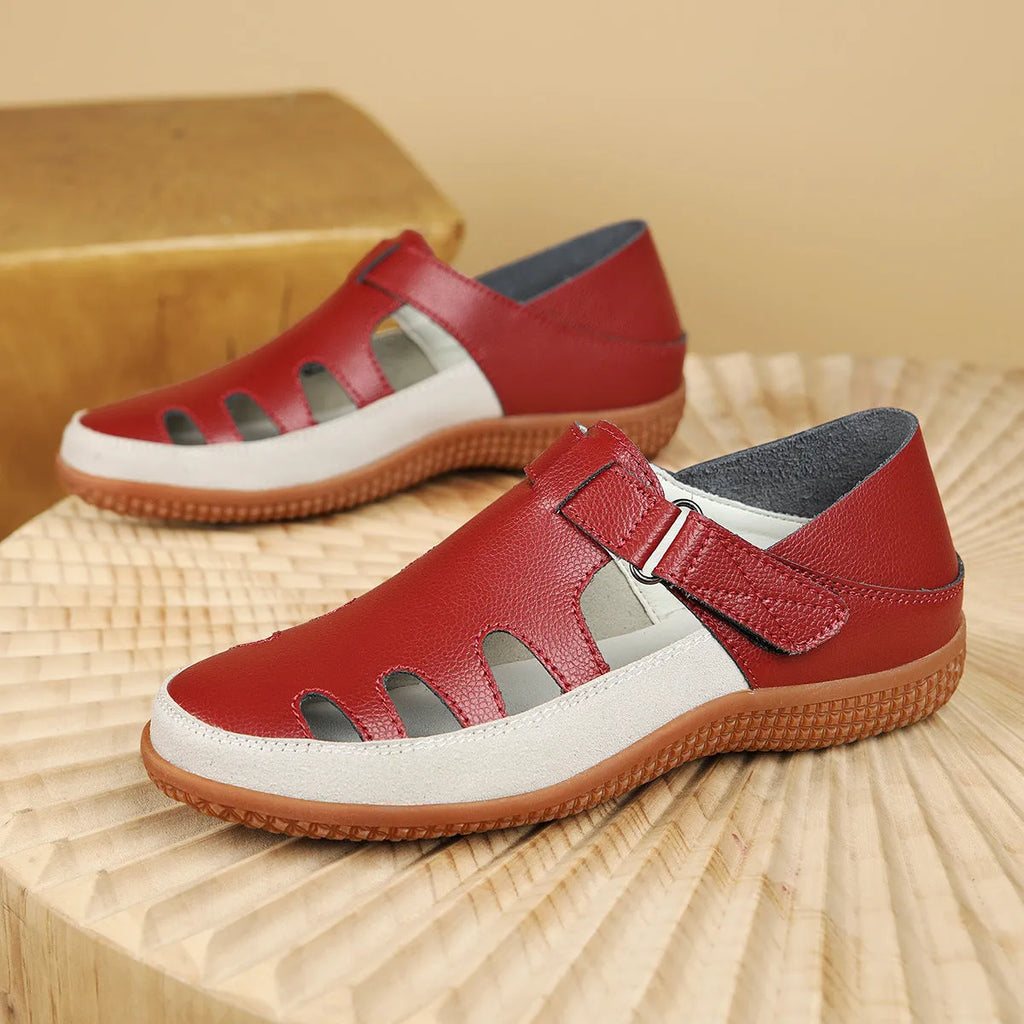 Plus size women's flat sandals in blue with a hollow toe cap and thick rubber sole.