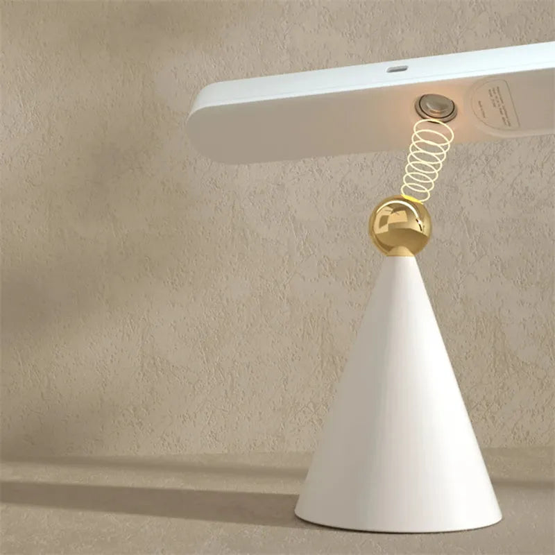 Geometric desk lamp with magnetic suction showing touch switch and USB power connection