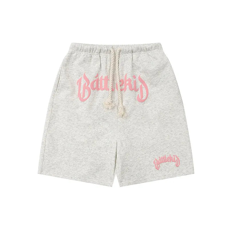 A pair of cropped, loose-fit sweatpants in a cotton blend fabric for casual streetwear.