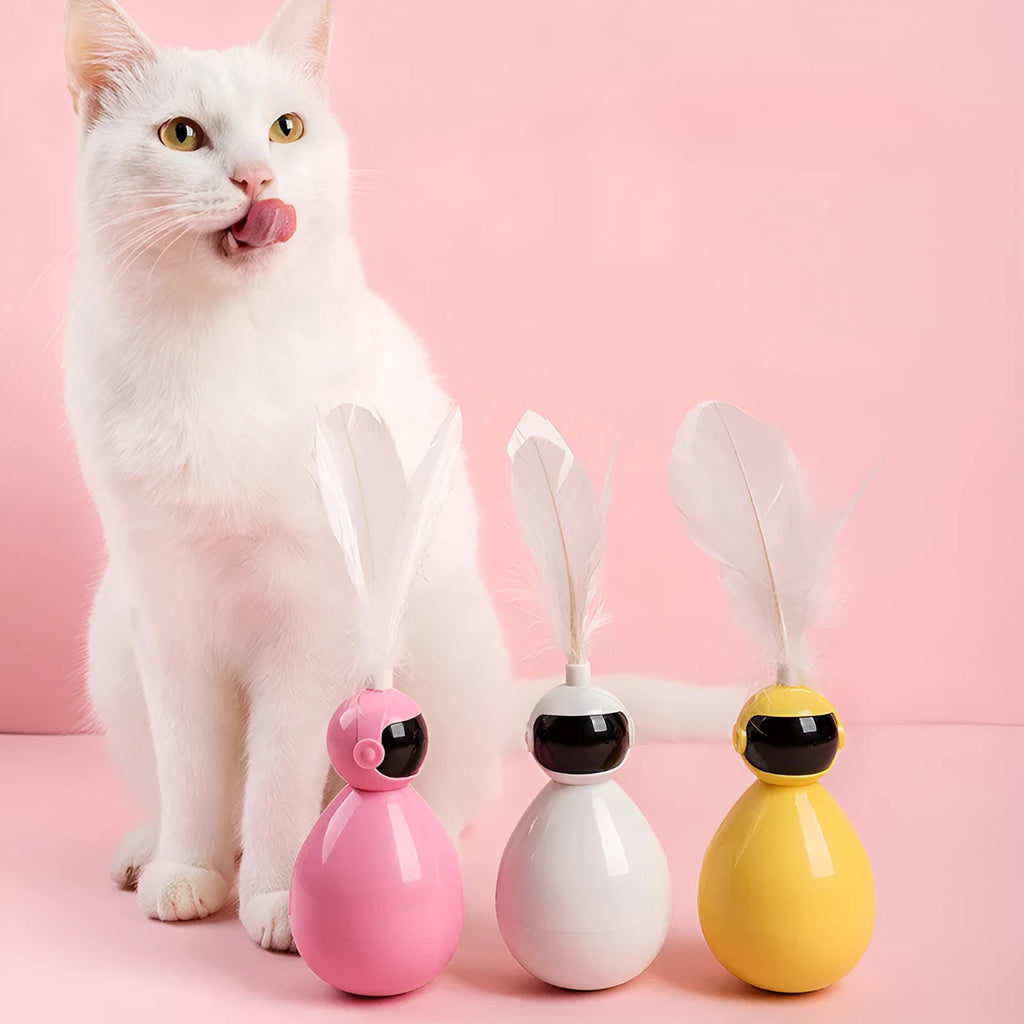 ABS tumbler cat toy with feather attachment and 3 feather replacements in white, yellow, and pink