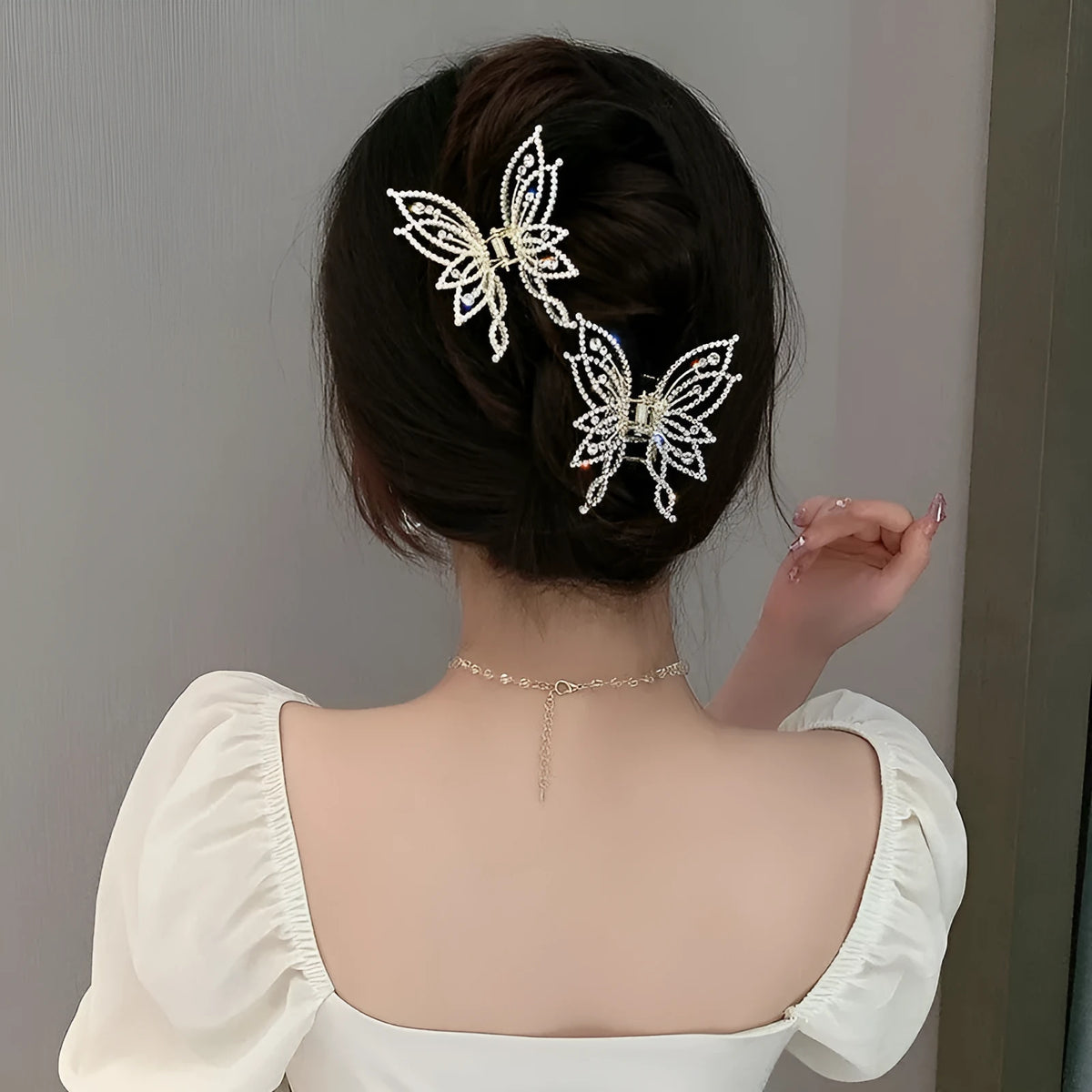 Butterfly hair barrettes for women in alloy metal with rhinestone or pearl style finishes