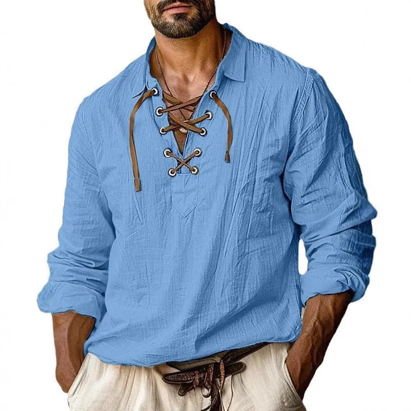 Men's loose fit long sleeve linen blend shirt in blue with a lapel collar, laid flat.