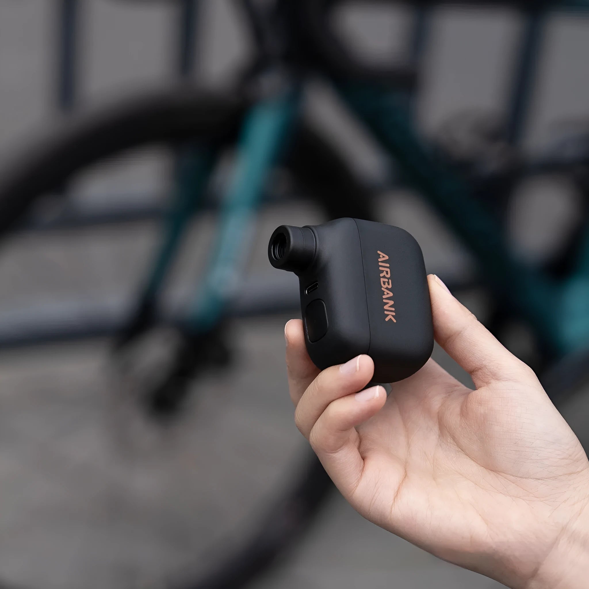 Black AS100 mini electric bicycle pump with USB cable and waterproof bag