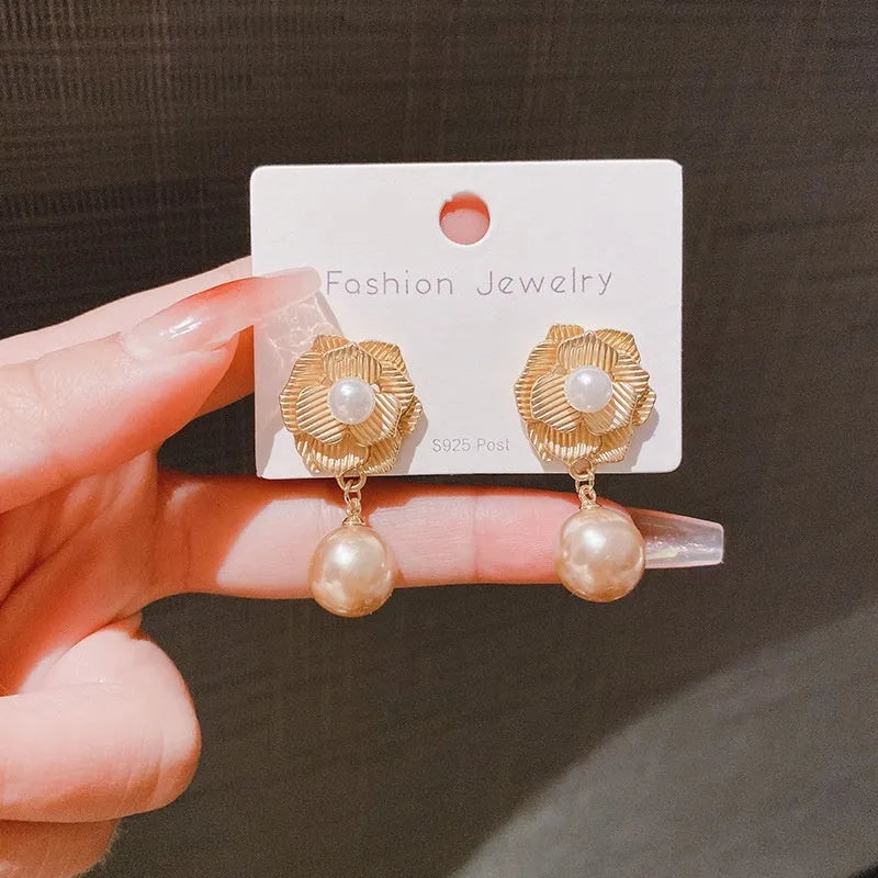 Gold Hong Kong style flower stud earrings with pearl rose design and ice flower pattern