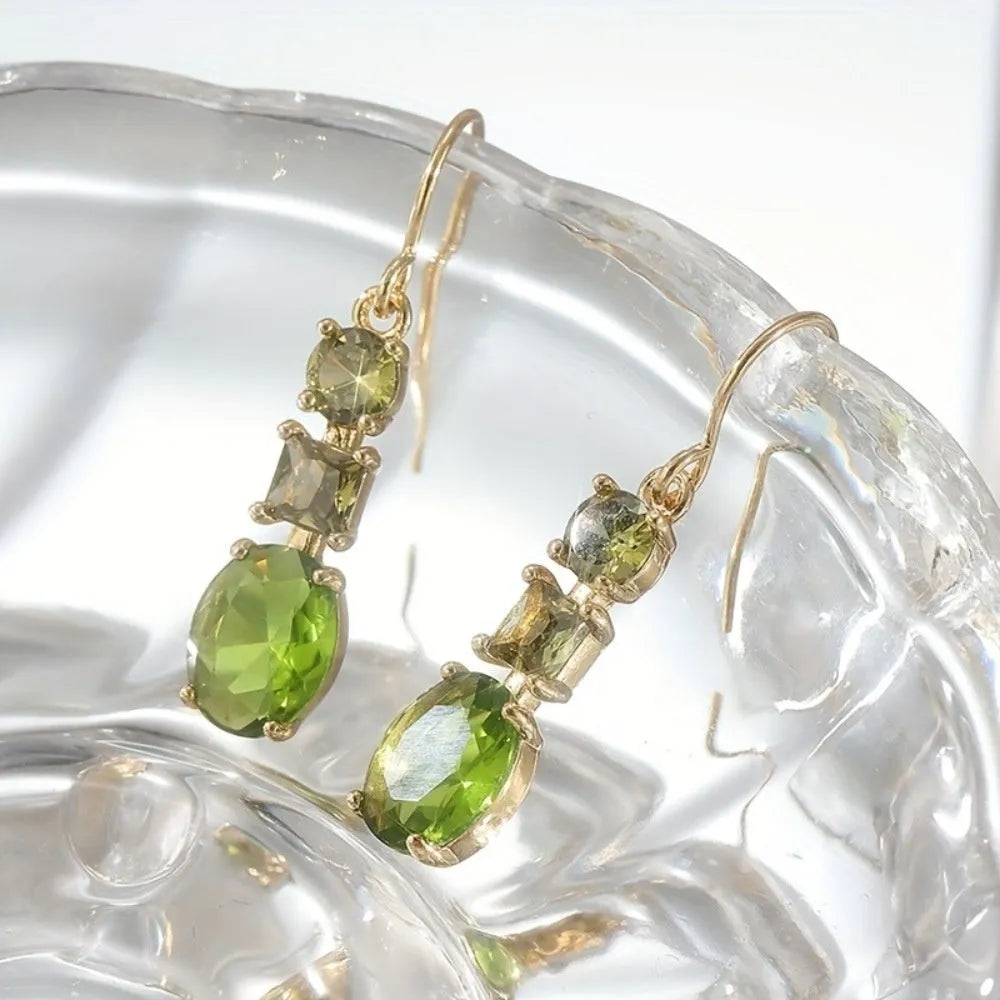 A pair of green geometric copper earrings with a quadrilateral shape in a retro bohemian style.