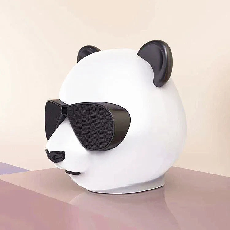 Classic style portable mini Bluetooth speaker showing front grille and likely a USB charging port.