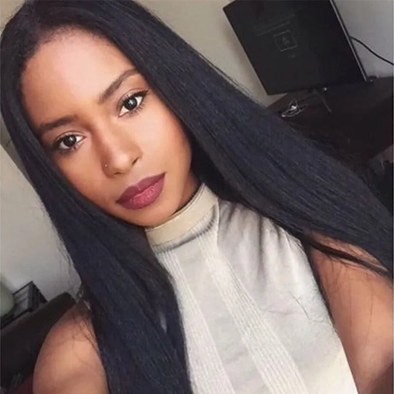 Long straight black synthetic wig with centre-parted bangs on a model