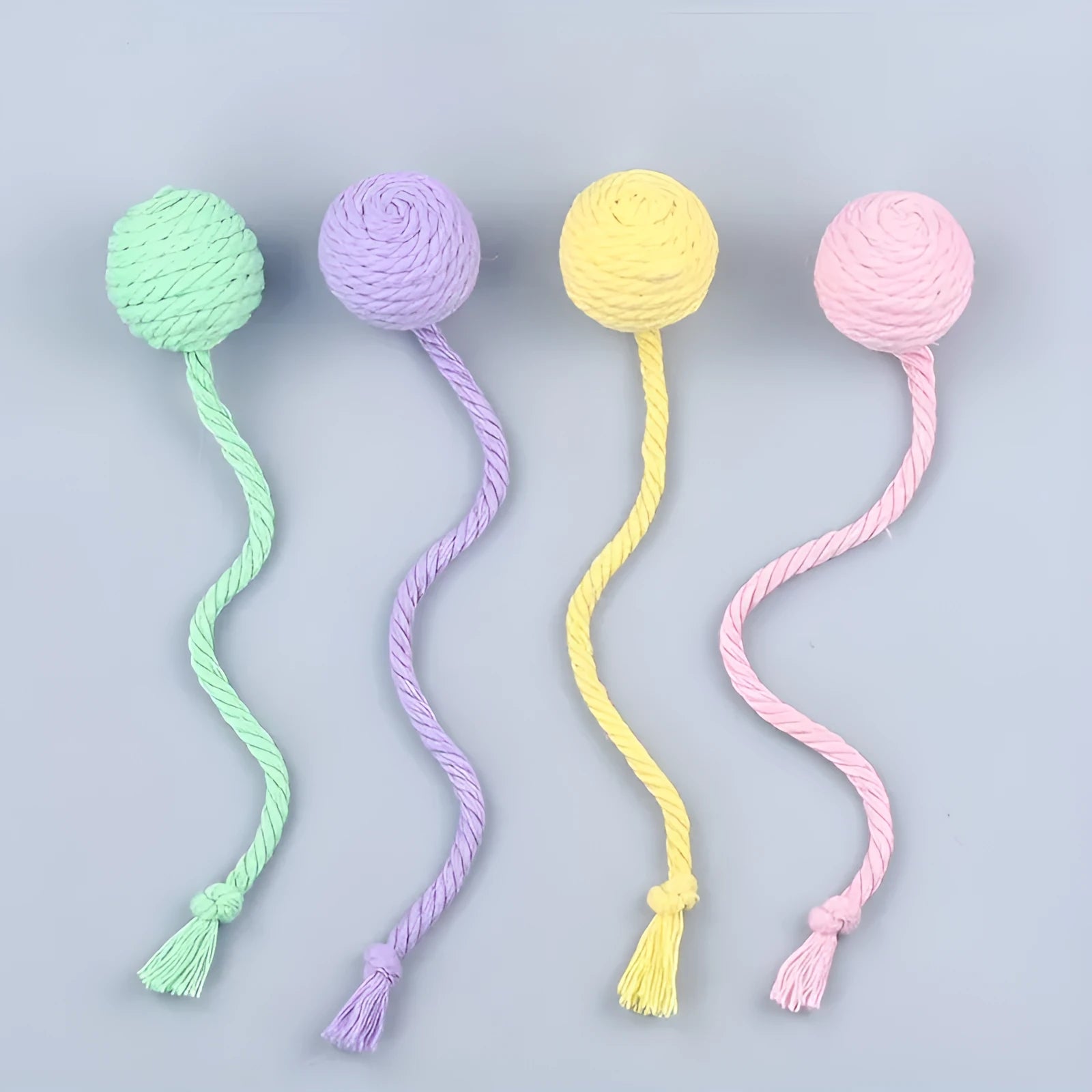Green cat toy ball with a built-in rope and bell in a 6cm size.