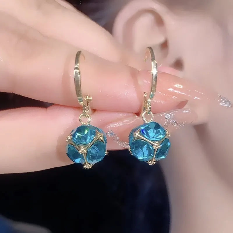 Geometric rose design copper earrings with zircon stones in an electroplated colour finish.