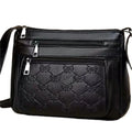 Butterfly black PU leather crossbody messenger bag showing embossed texture and sewing thread details