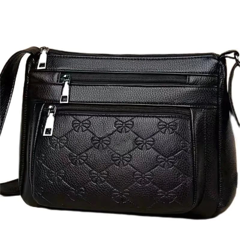 Butterfly black PU leather crossbody messenger bag showing embossed texture and sewing thread details