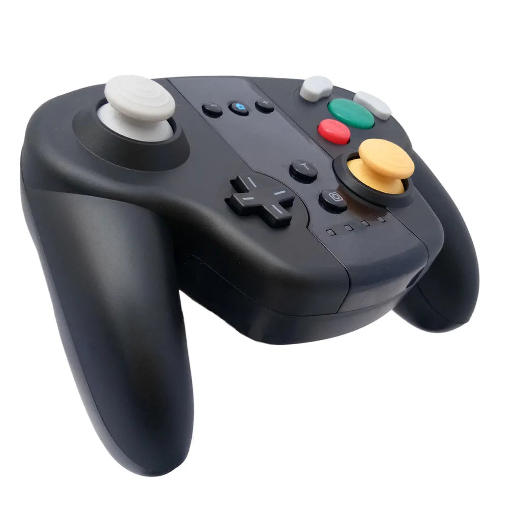 Black wireless gamepad with colourful packaging showing Switch and Windows compatibility, NFC function, and Bluetooth connectivity