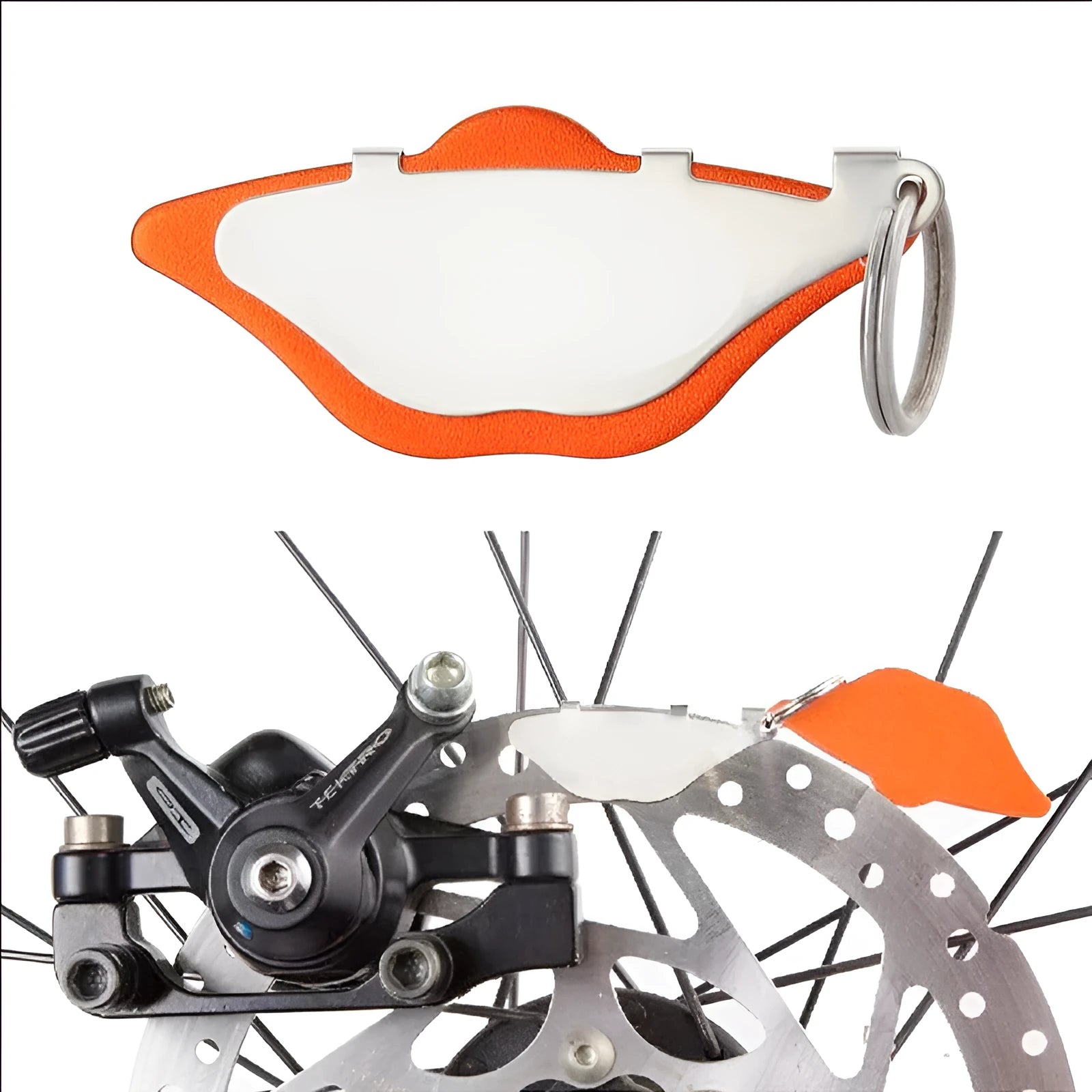 Black and orange mountain bike disc brake pads with metal construction and adjustment flaps