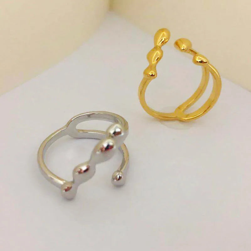 Brass adjustable opening ring with circular design in gold or silver finish for women