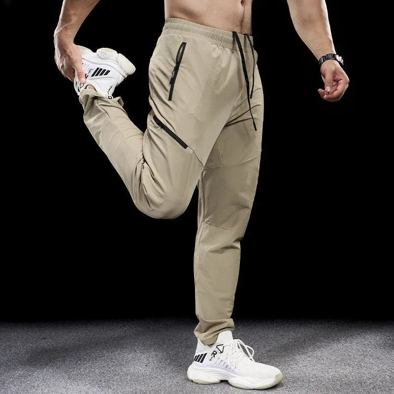 Men's waterproof quick-drying nylon workout pants in Army Green colour, showing mid waist design and trousers length