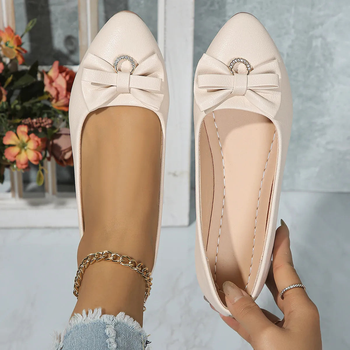 Women's flat casual beige shoes with a bowknot on the shallow mouth and a round toe.