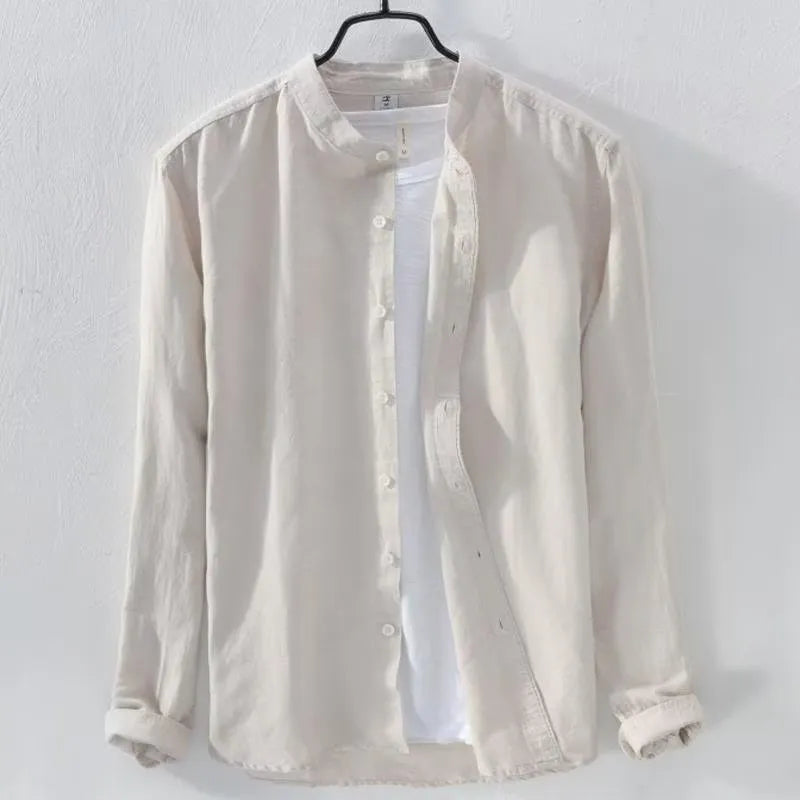 Man wearing a loose fit light blue cotton linen long sleeve casual shirt.