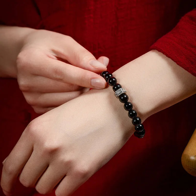 8mm diameter obsidian zodiac bracelet with hand-carved animal modelling in ethnic style