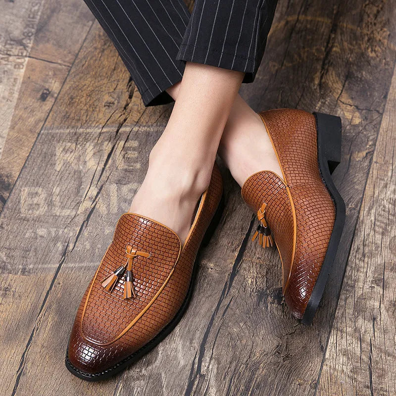 Men's black pointed toe slip-on business shoes with tassel detail on artificial PU upper