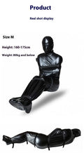 Black patent leather body wrap set with six silver ratchet tie-down straps laid out.