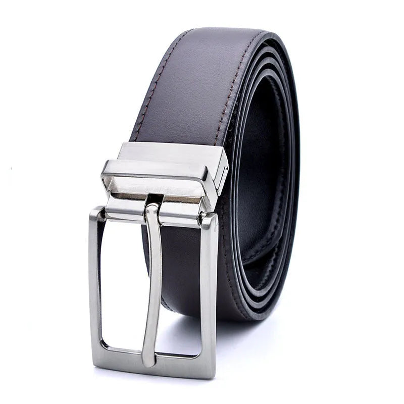 Men's dark brown genuine leather belt with a rotating silver alloy pin buckle on a wooden surface