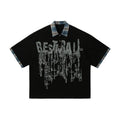 Men's loose blue short-sleeved cotton top with an asymmetric graffiti print design.