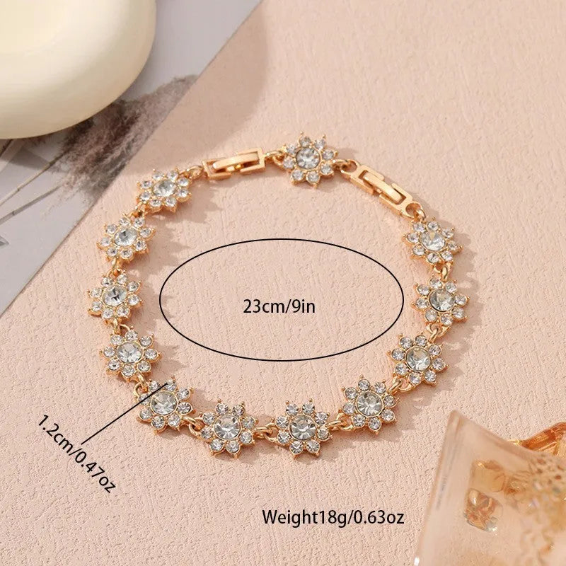 Floral coloured gemstone bracelet in zinc alloy with electroplated gold and silver crystal finishes.