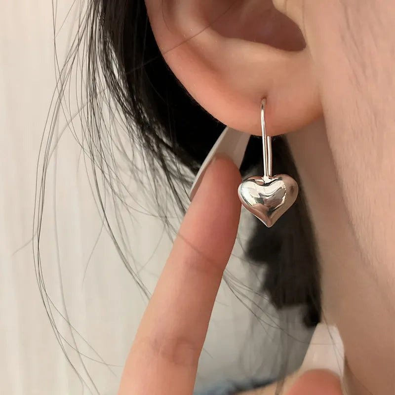 Korean style 3D heart-shaped earrings with glossy finish and silver colour