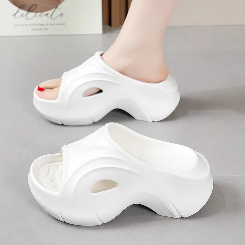 Women's thick-soled round-toe EVA slippers in rose red colour on a white background.
