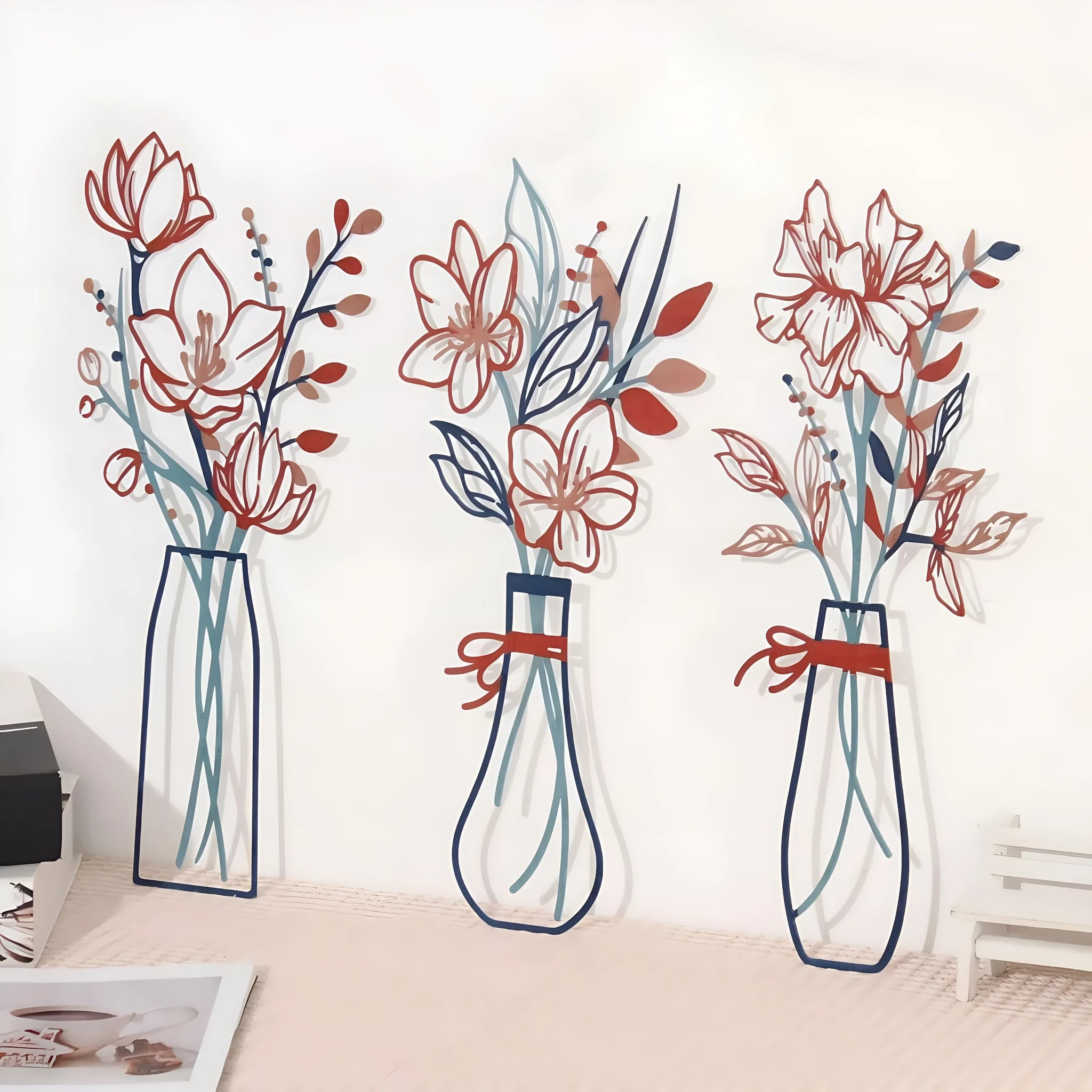 Three metal flower wall art pieces in farmhouse country style with vase designs