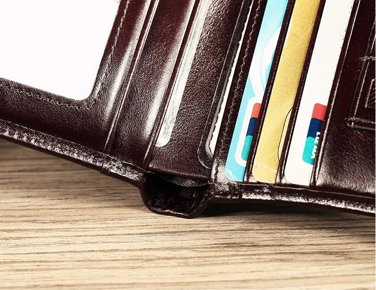 Men's leather wallet open showing card slots, coin pocket, photo window, and document holder in black or brown