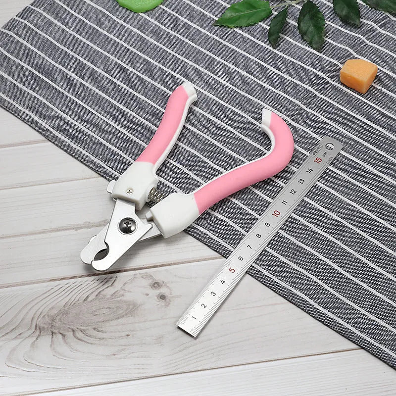 Pet nail scissors with curved handle, stainless steel cutter head, available in blue or pink small or large.