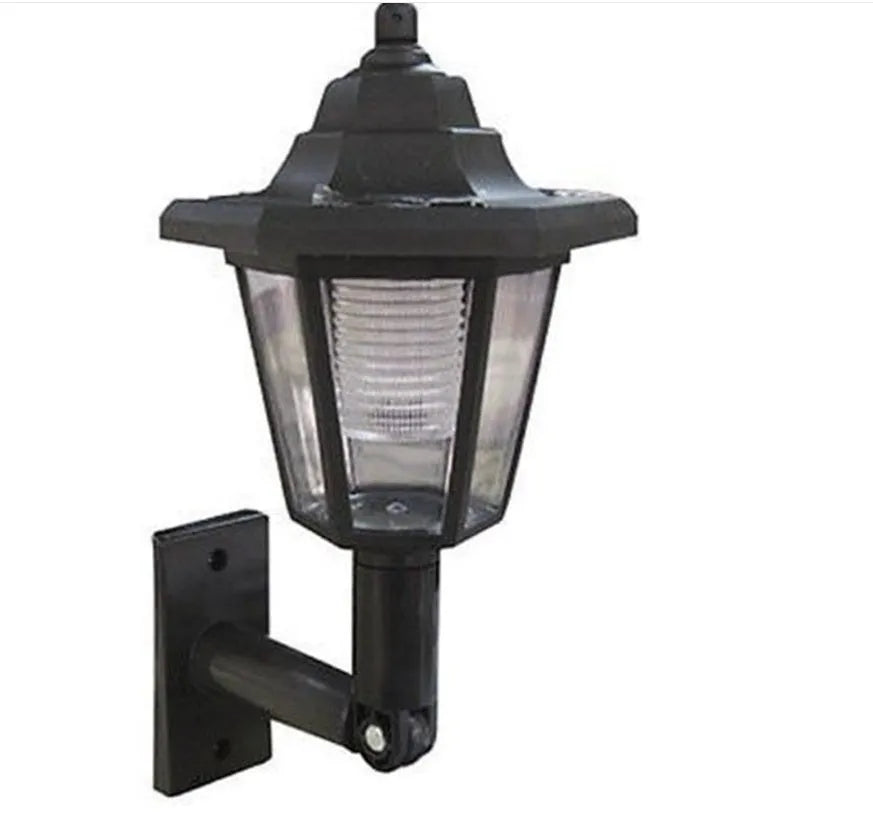 Black hexagonal solar-powered outdoor wall lamp with integrated solar panel