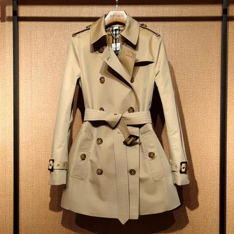 Khaki double-breasted women's trench coat with long flight sleeves and button front.