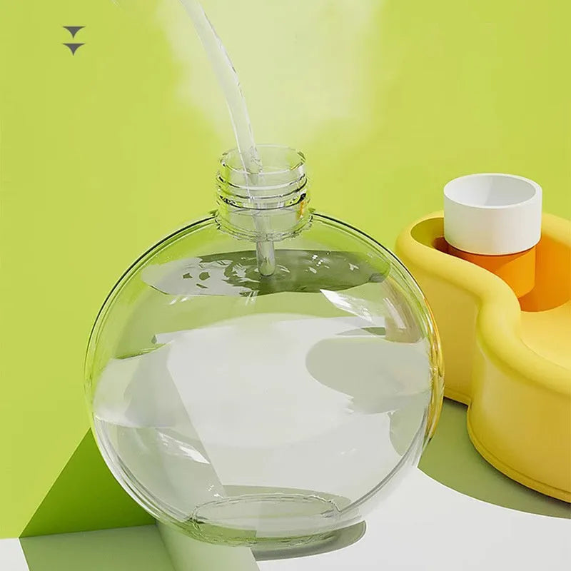 Green portable dog water bottle with retractable drinking bowl for travel and outdoor use.