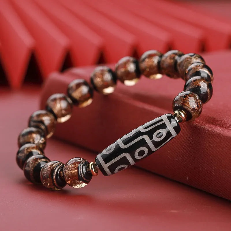 Close-up of a colourful Chinese snake year lucky bead bracelet made from hand-strung coloured glaze.