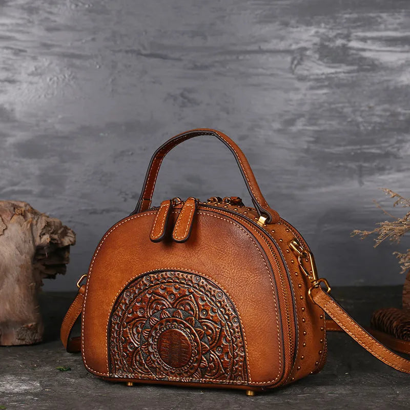 Vintage suede leather handbag in graphite ash showing interior ID, phone, and zipper pockets.