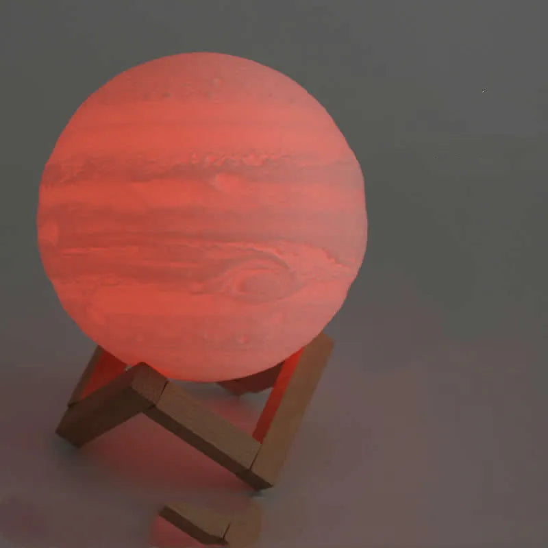3D printed white moon lamp with detailed craters on a wooden stand, showing touch ring at base.
