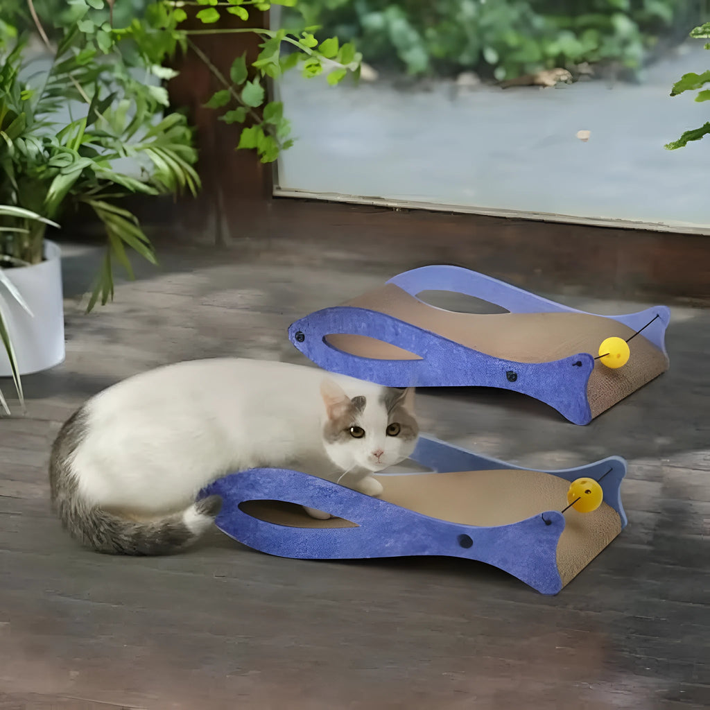 Blue fish-shaped cardboard cat scratcher with bell toys on elastic cord for indoor furniture protection