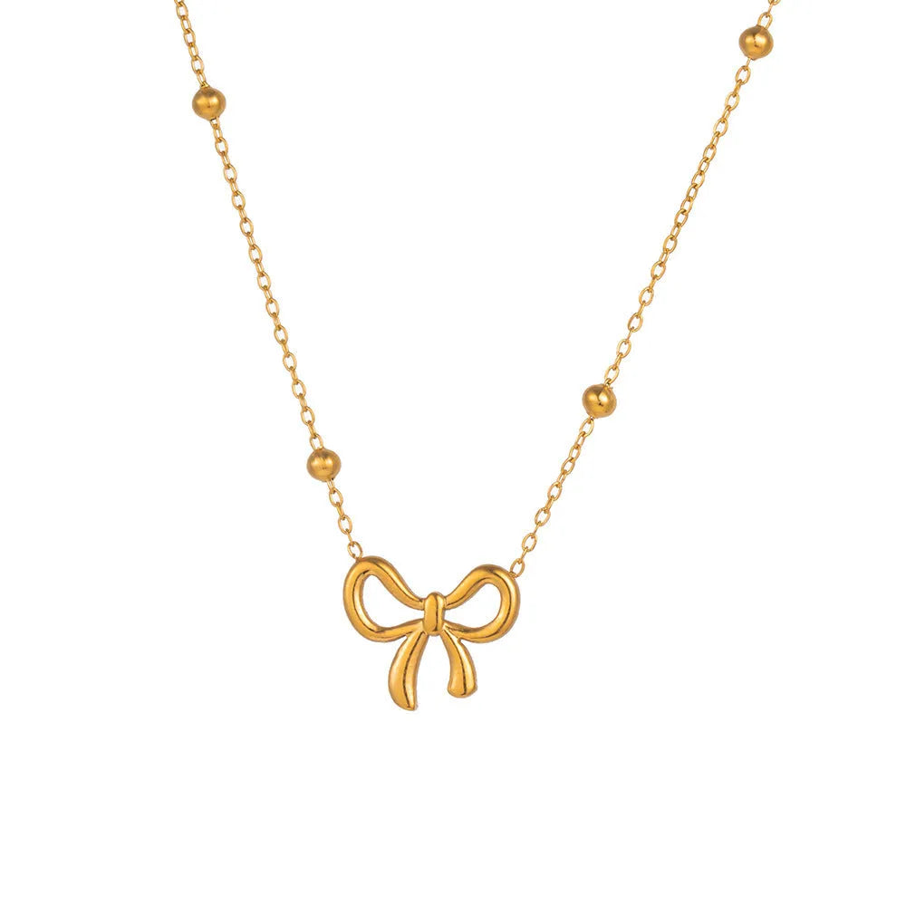 Gold-coloured women's bow necklace with cross chain design on adjustable 41-50cm perimeter